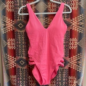 BECCA coral/pink one piece swimsuit.